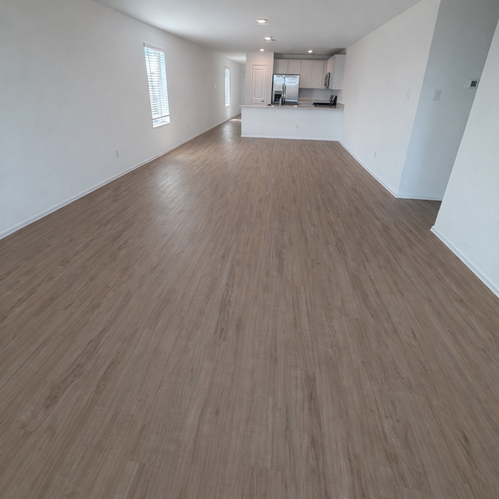 1315 Millers Pass Drive Rosenberg, TX 77471 - Photo 3 of 10 wooden floor in an empty room with a window