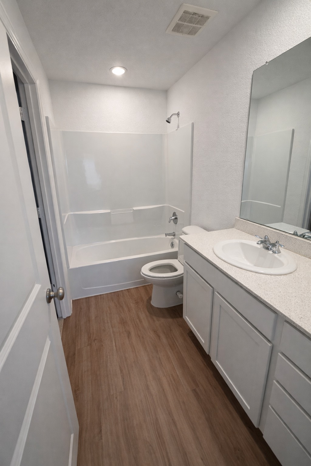1315 Millers Pass Drive Rosenberg, TX 77471 - Photo 6 of 10 a bathroom with a sink a toilet a tub and shower