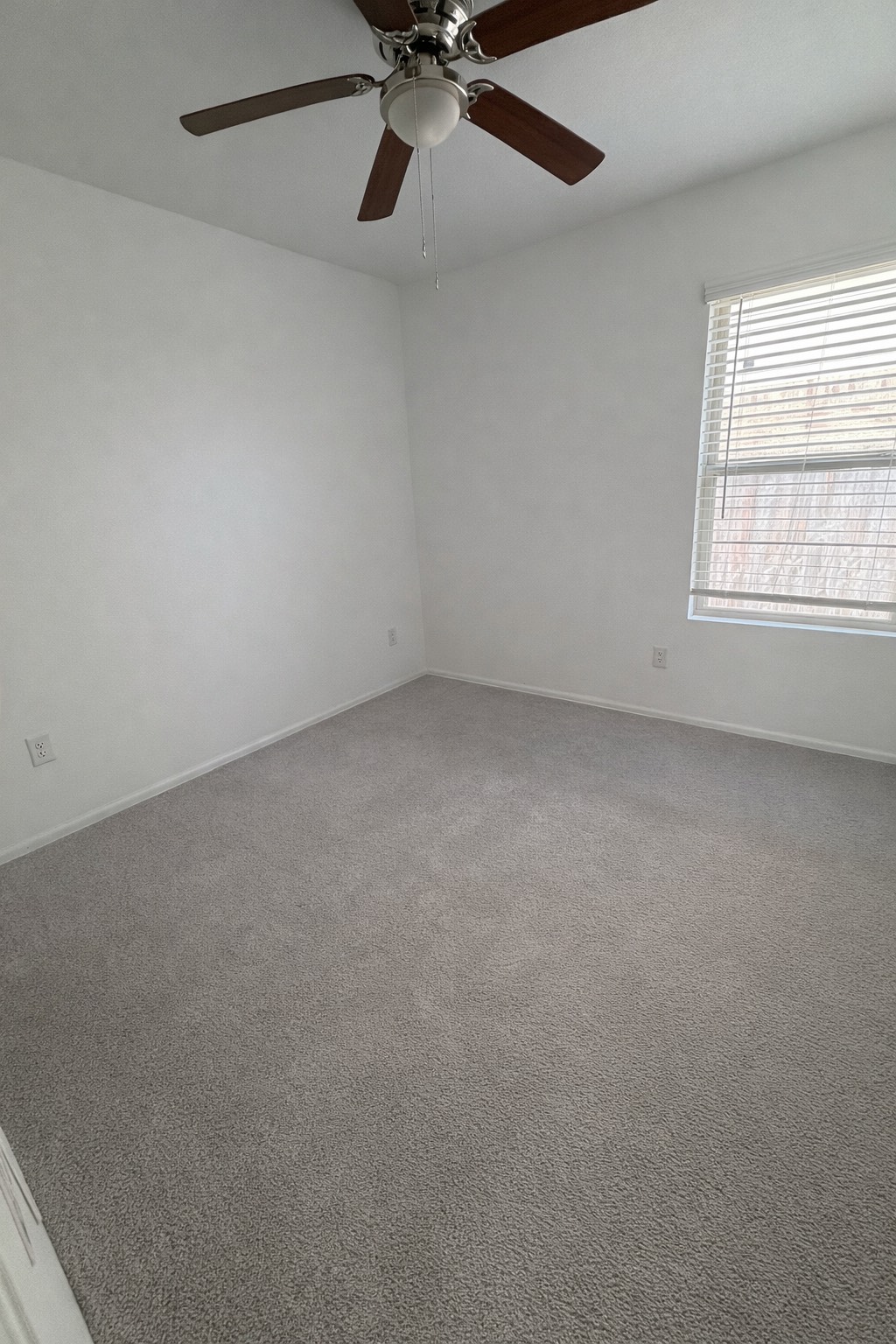 1315 Millers Pass Drive Rosenberg, TX 77471 - Photo 9 of 10 an empty room with a window and a fan