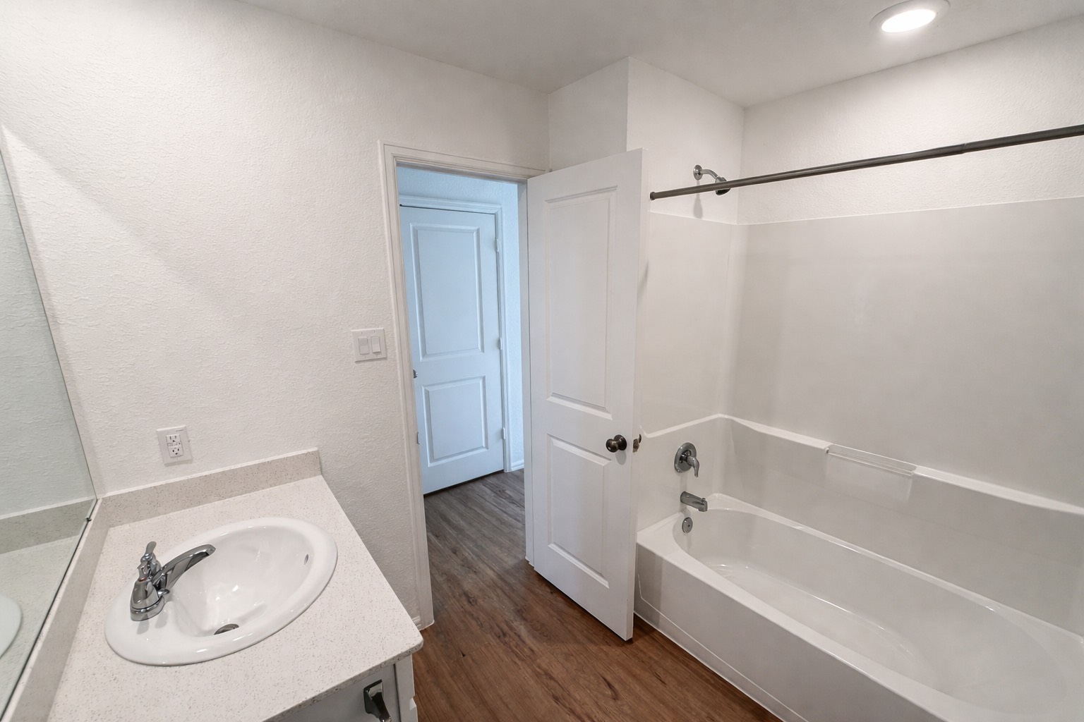 1315 Millers Pass Drive Rosenberg, TX 77471 - Photo 10 of 10 a white bath tub sitting next to a white sink and a mirror