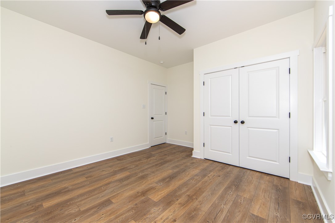2517 Jackson Shop Road Goochland, VA 23063 - Photo 19 of 25 Bedroom three offers LVP floors, a ceiling fan, ba