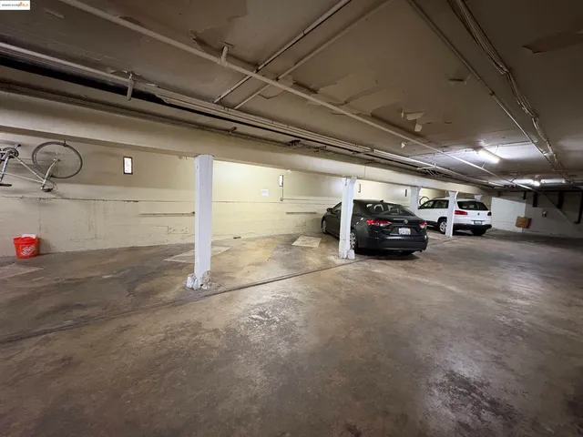 a view of parking garage with cars