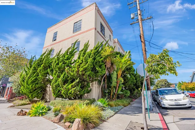 a picture of a building with a garden