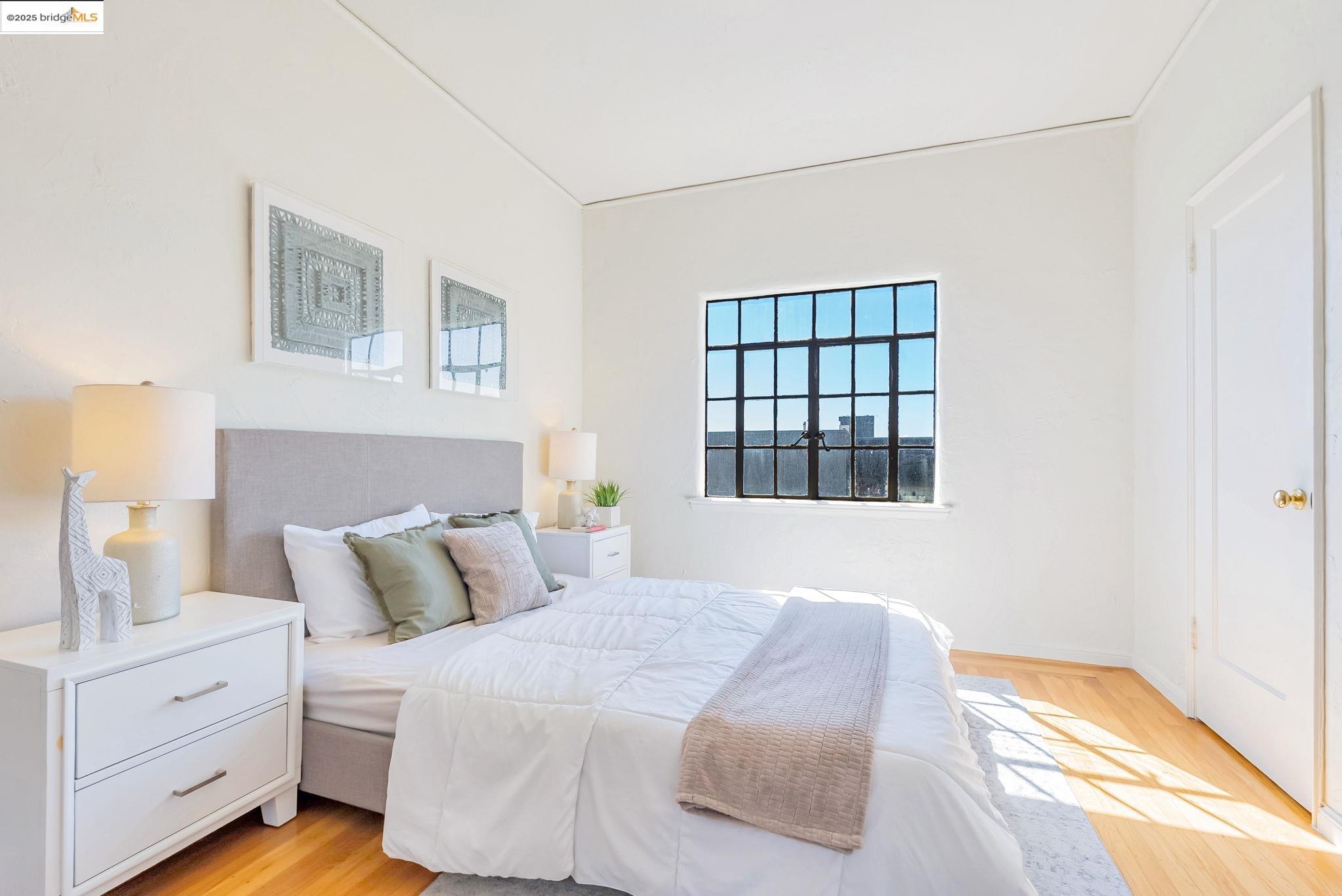 848 Stannage Avenue, Unit 11 Albany, CA 94706 - Photo 10 of 24 Bedroom featuring light wood finished floors and baseboards