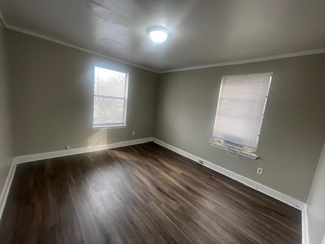 1249 Maria Street Memphis, TN 38122 - Photo 11 of 12 Empty room featuring dark wood-style flooring and crown molding