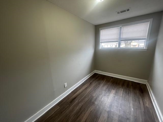 1249 Maria Street Memphis, TN 38122 - Photo 6 of 12 Unfurnished room with dark wood-type flooring and baseboards