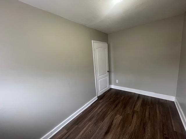 1249 Maria Street Memphis, TN 38122 - Photo 7 of 12 Spare room with dark wood finished floors and baseboards