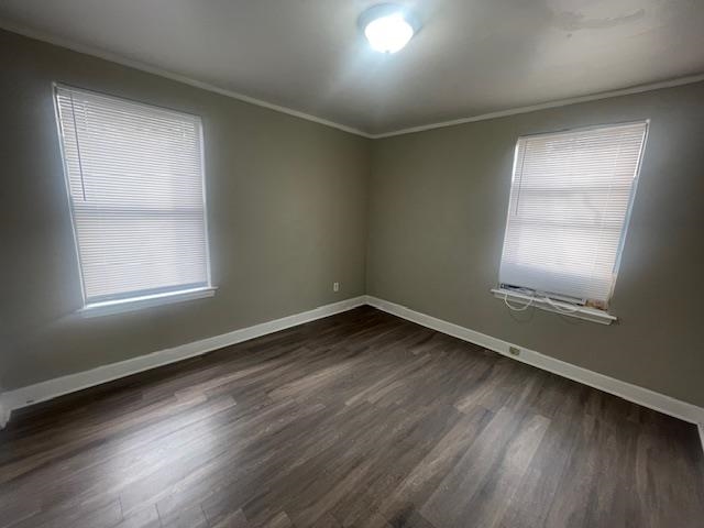 1249 Maria Street Memphis, TN 38122 - Photo 9 of 12 Unfurnished room featuring dark wood-type flooring and crown molding