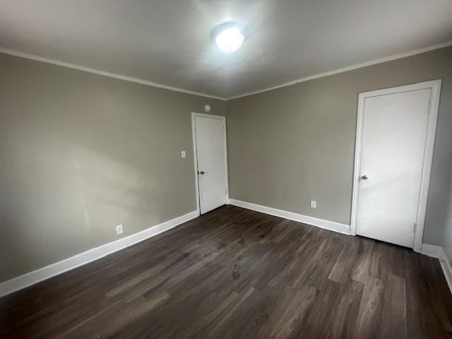 1249 Maria Street Memphis, TN 38122 - Photo 10 of 12 Unfurnished bedroom featuring dark wood-style floors and ornamental molding