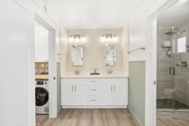 a view of bathroom with dual sinks
