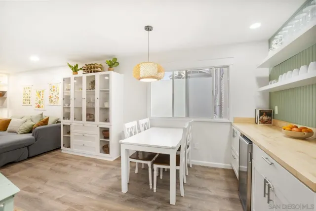 a kitchen that has a table and chairs in it