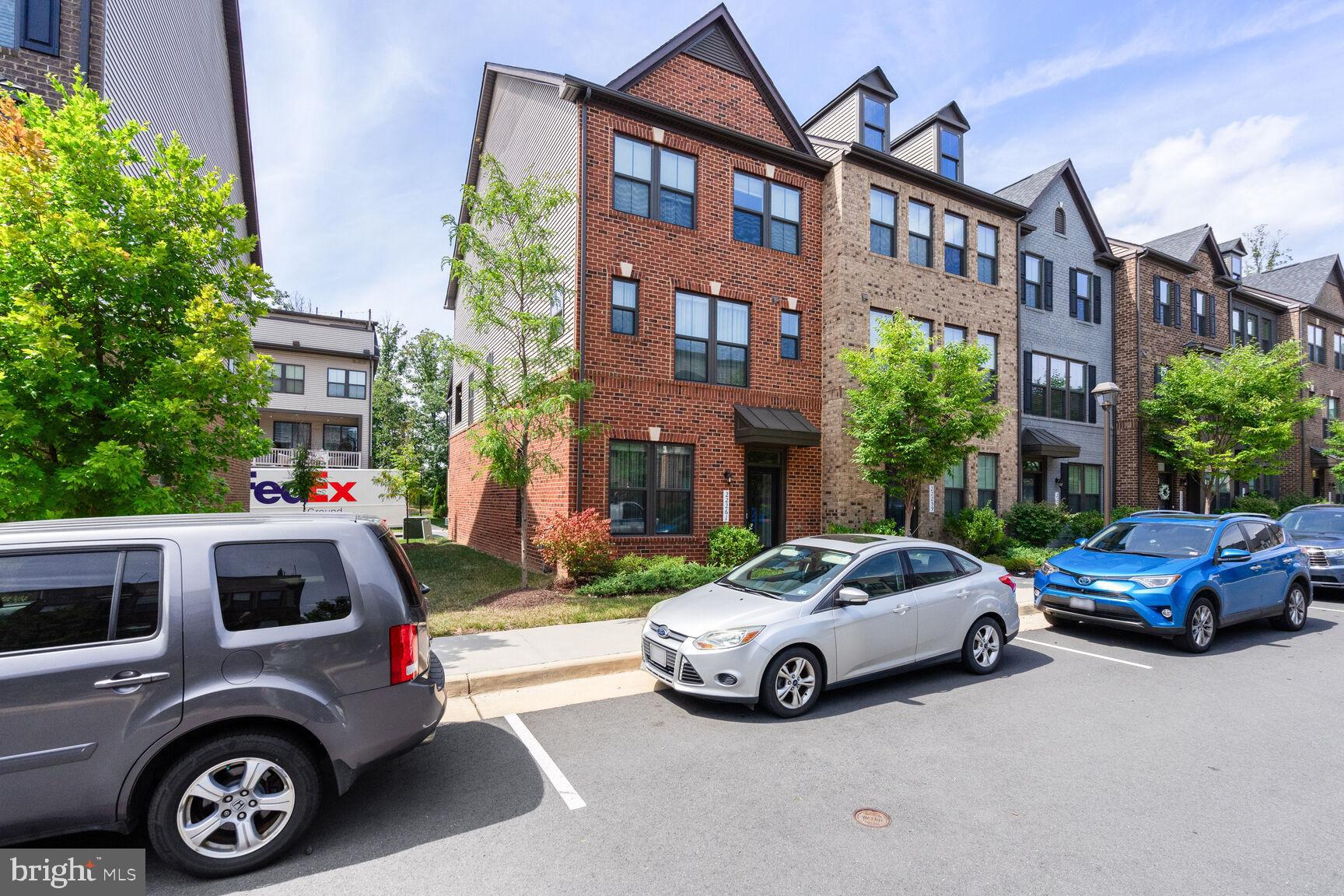 22261 Sims Terrace Ashburn, VA 20148 - Photo 1 of 15 a car parked in front of a house