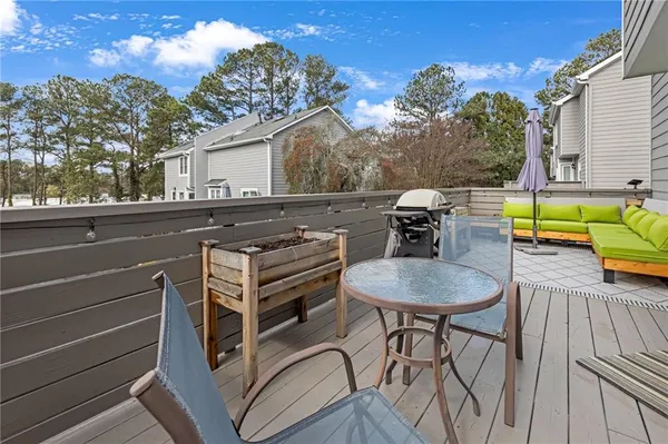 a terrace of a house with outdoor seating