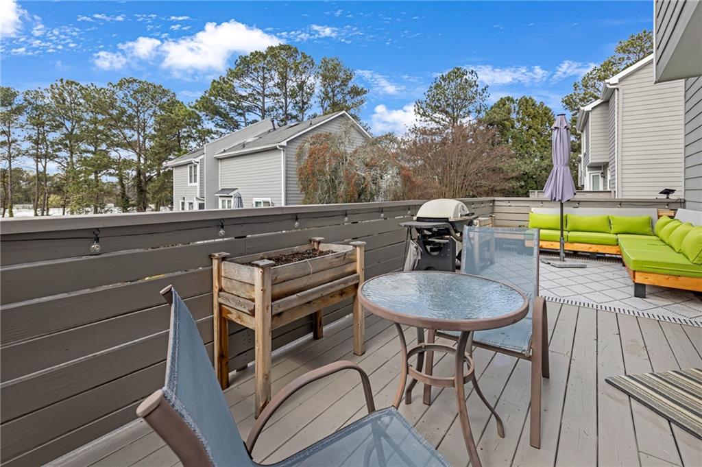1206 Defoor Court Northwest, Unit 2A Atlanta, GA 30318 - Photo 11 of 36 a terrace of a house with outdoor seating