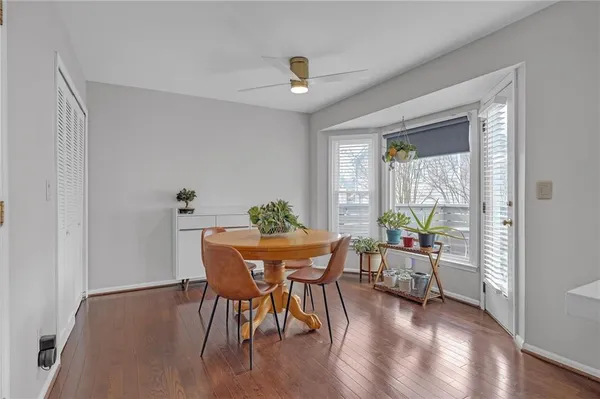 a view of a dining room with furniture window and wooden floor