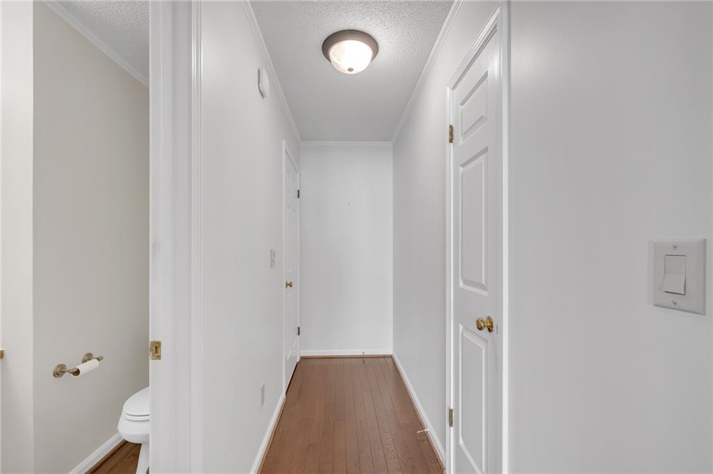 1206 Defoor Court Northwest, Unit 2A Atlanta, GA 30318 - Photo 24 of 36 a view of a hallway with wooden floor and closet