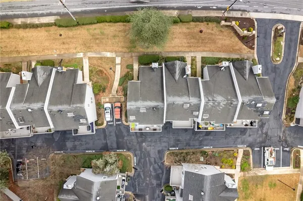 an aerial view of a house with outdoor space