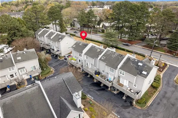 an aerial view of houses with outdoor space
