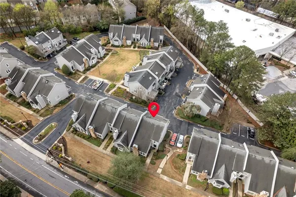 an aerial view of residential houses with outdoor space