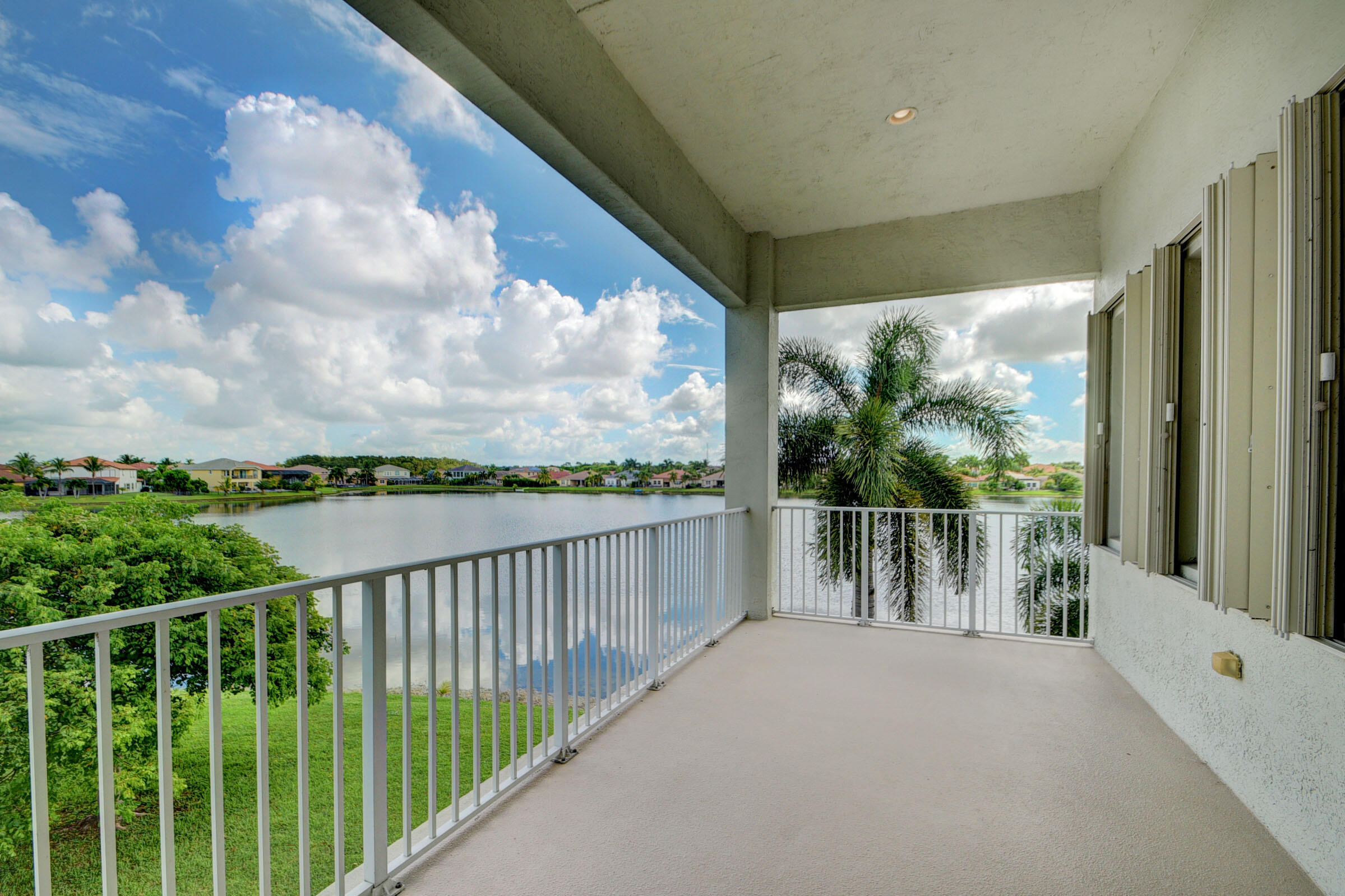 2742 Treanor Terrace Wellington, FL 33414 - Photo 14 of 44 a balcony with wooden floor