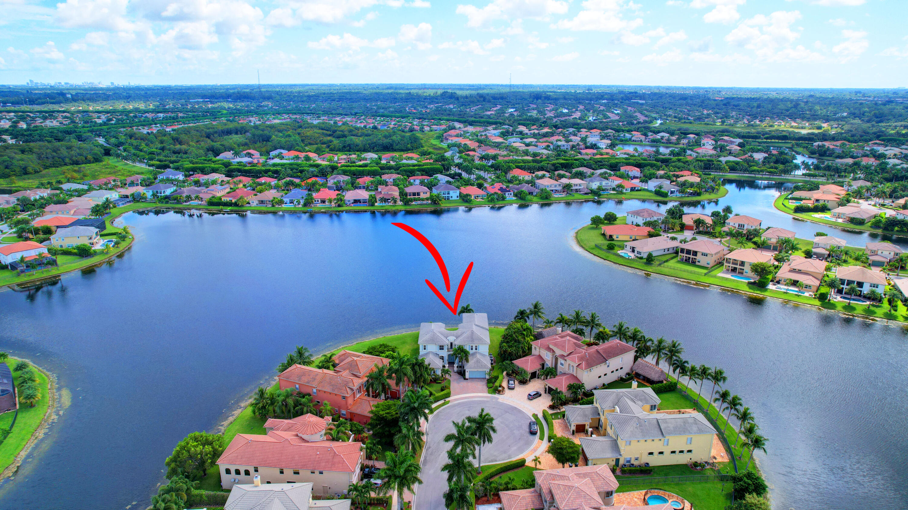2742 Treanor Terrace Wellington, FL 33414 - Photo 15 of 44 an aerial view of a houses with a lake