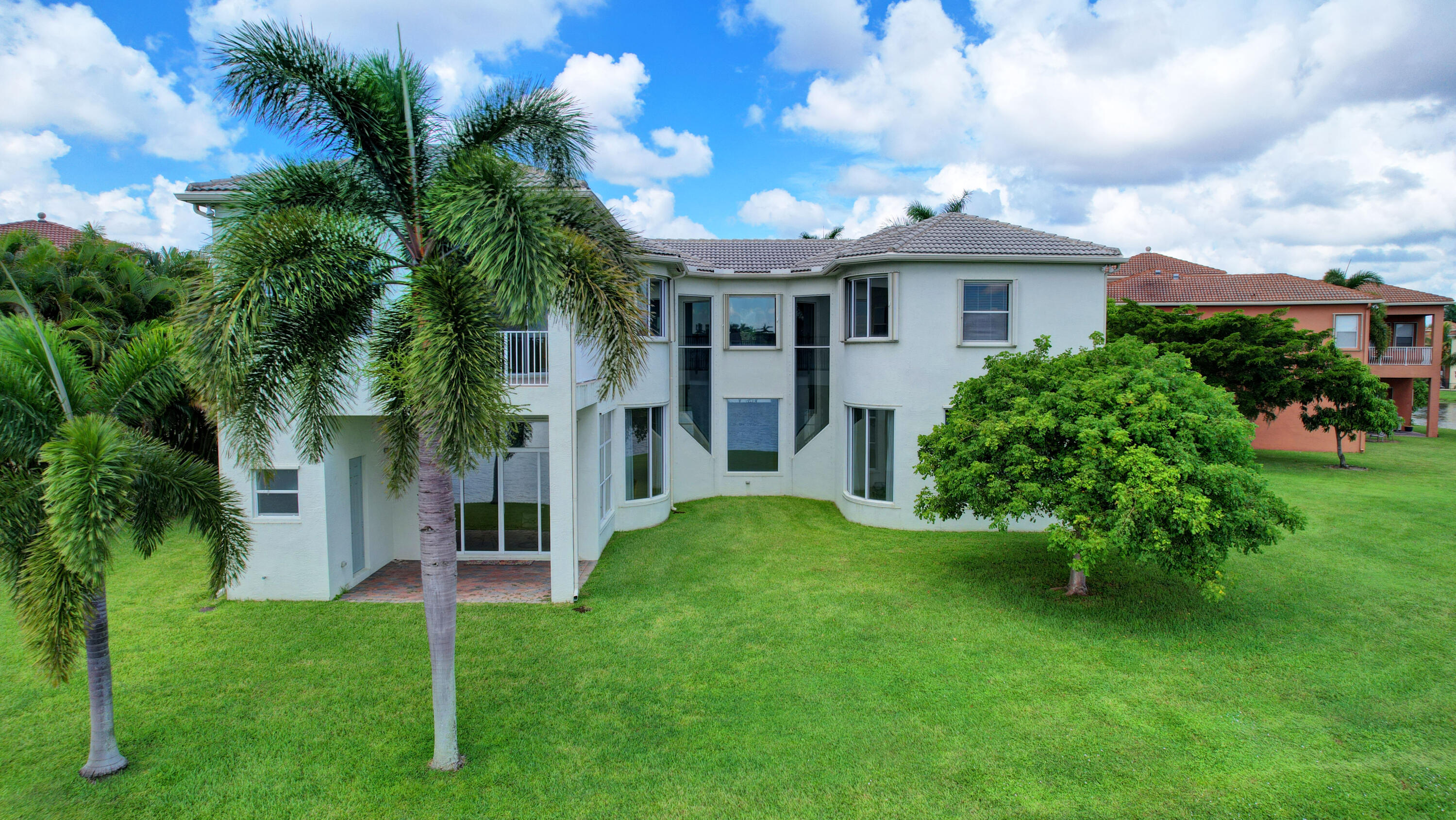 2742 Treanor Terrace Wellington, FL 33414 - Photo 26 of 44 a front view of a house with a yard
