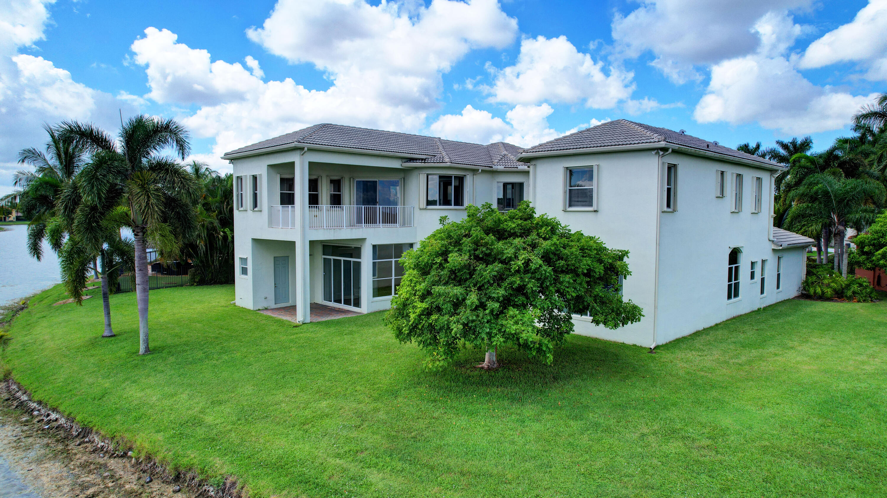 2742 Treanor Terrace Wellington, FL 33414 - Photo 28 of 44 a front view of a house with a garden