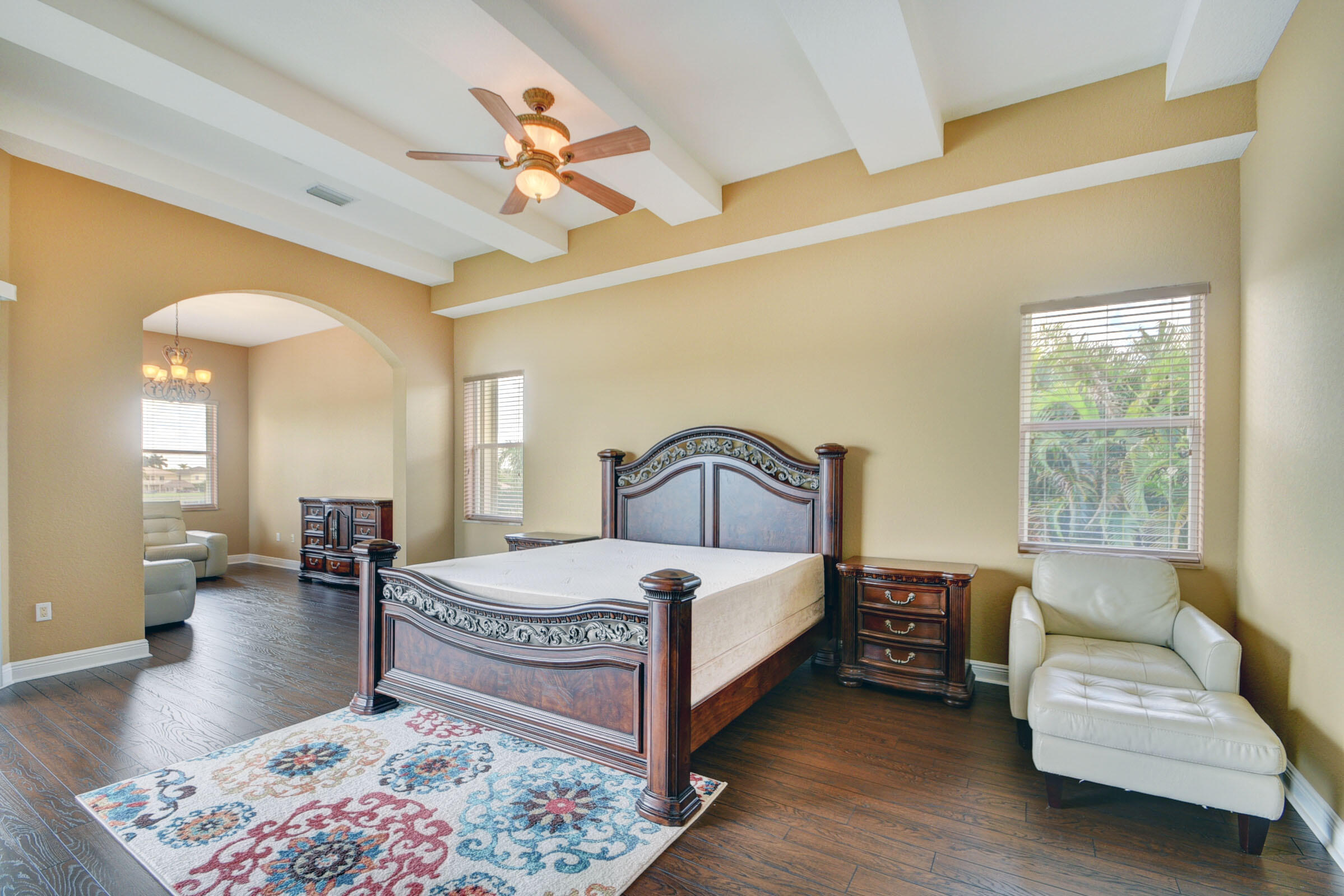 2742 Treanor Terrace Wellington, FL 33414 - Photo 9 of 44 a bedroom with a bed and a couch