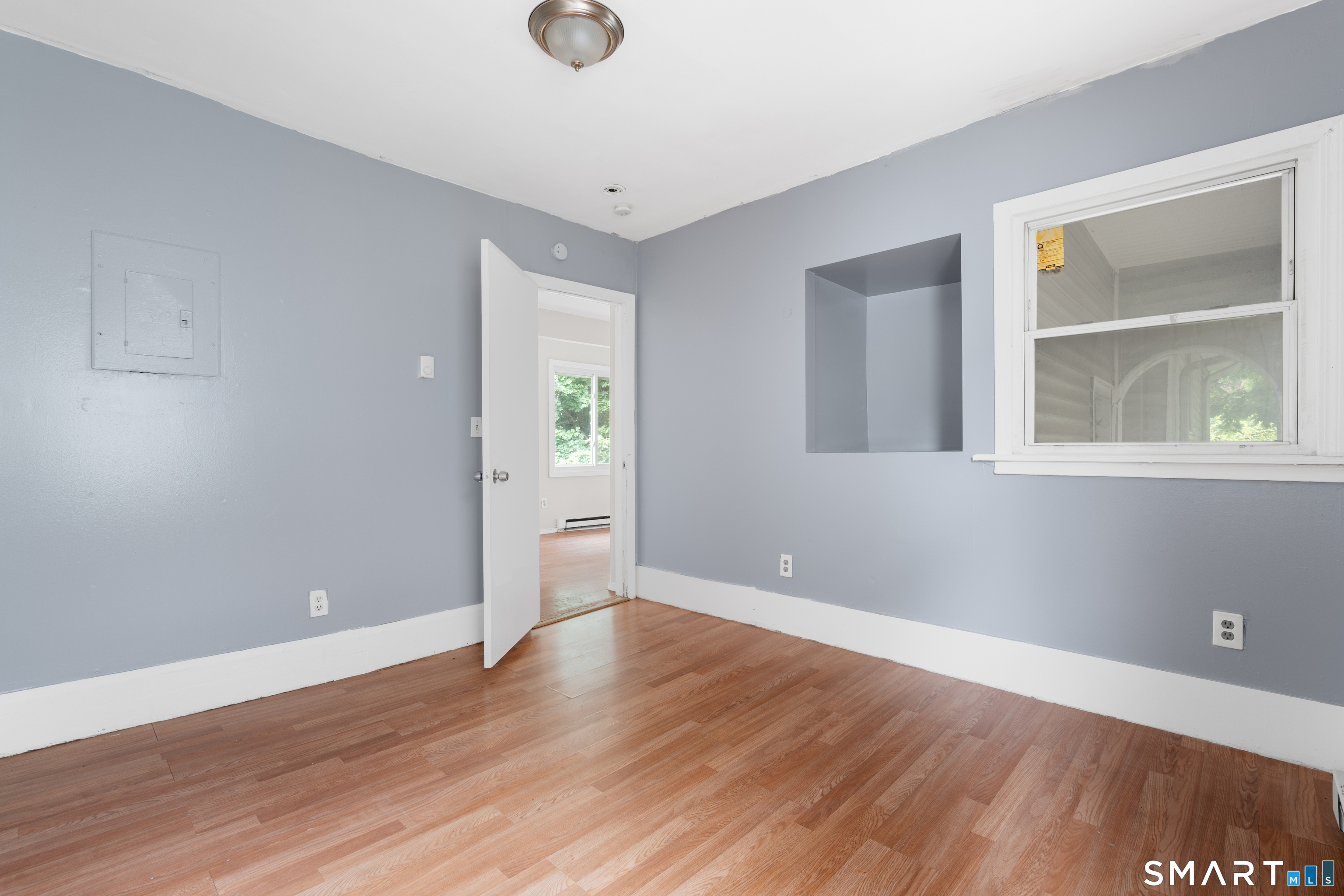 135 Prospect Street Waterbury, CT 06710 - Photo 14 of 19 a view of an empty room with wooden floor and a window