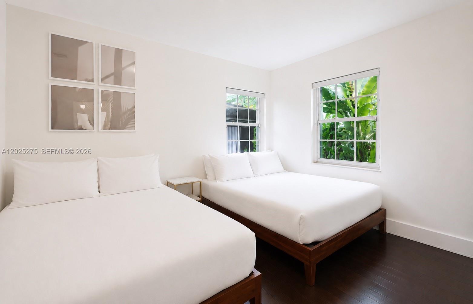 1329 Tyler Street Hollywood, FL 33019 - Photo 9 of 10 a bedroom with a bed and a window