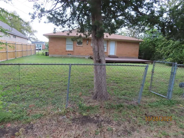 a backyard of a house with lots of green space