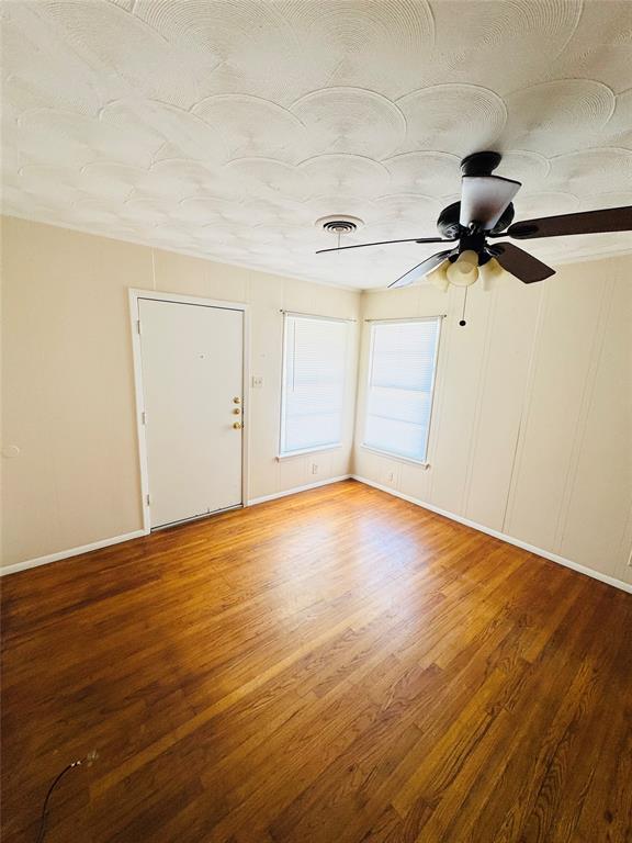 1719 Andrew Street Mesquite, TX 75149 - Photo 4 of 12 a view of empty room with wooden floor