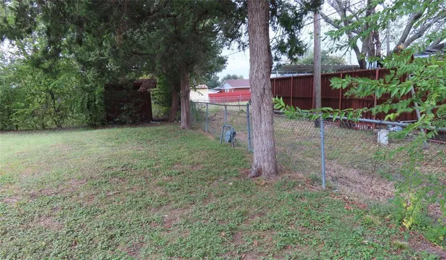 a backyard of a house with lots of green space