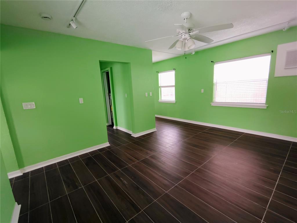 115 145th Avenue, Unit 3 Madeira Beach, FL 33708 - Photo 6 of 12 a view of empty room with window and fan
