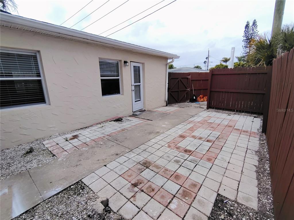 115 145th Avenue, Unit 3 Madeira Beach, FL 33708 - Photo 10 of 12 a view of a backyard