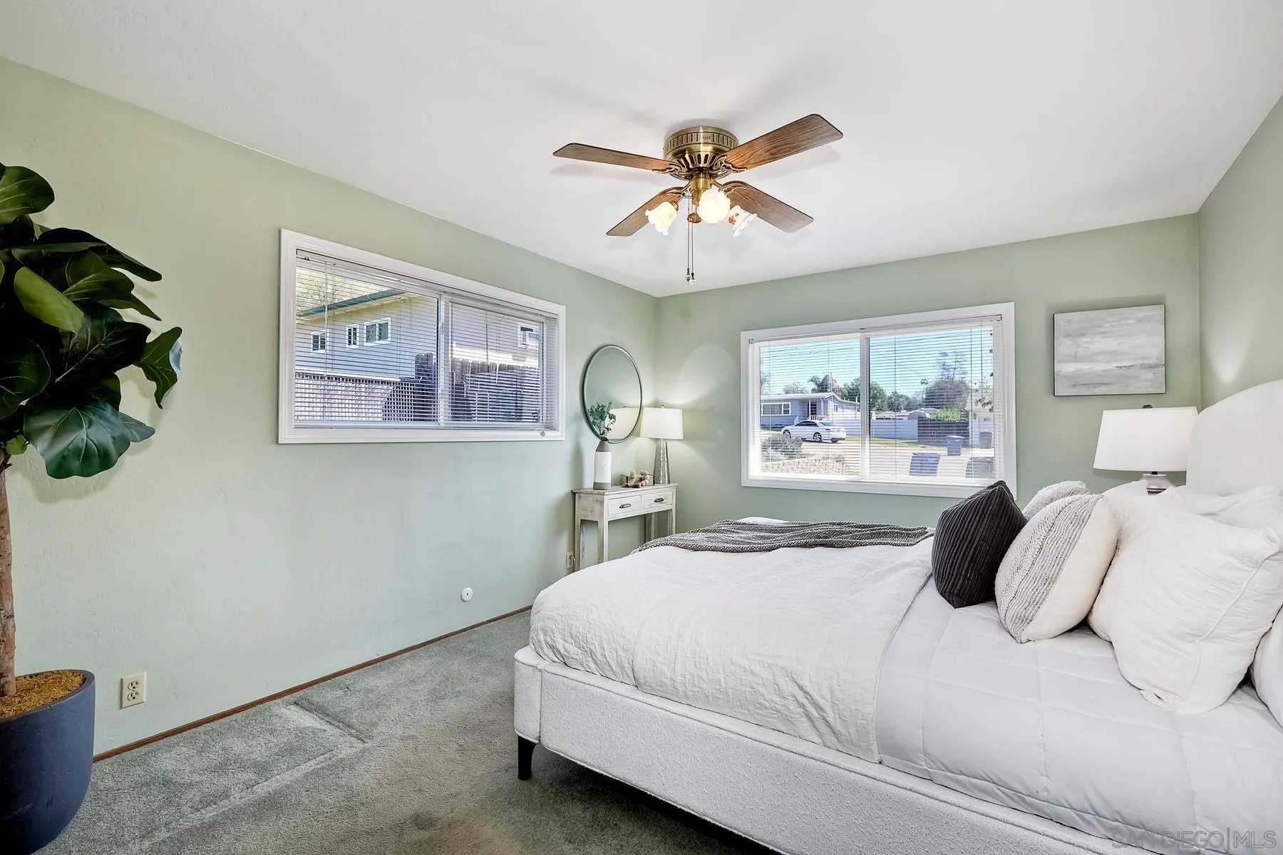 1346 Pepper Villa Drive El Cajon, CA 92021 - Photo 14 of 25 a bedroom with a large bed and a chandelier