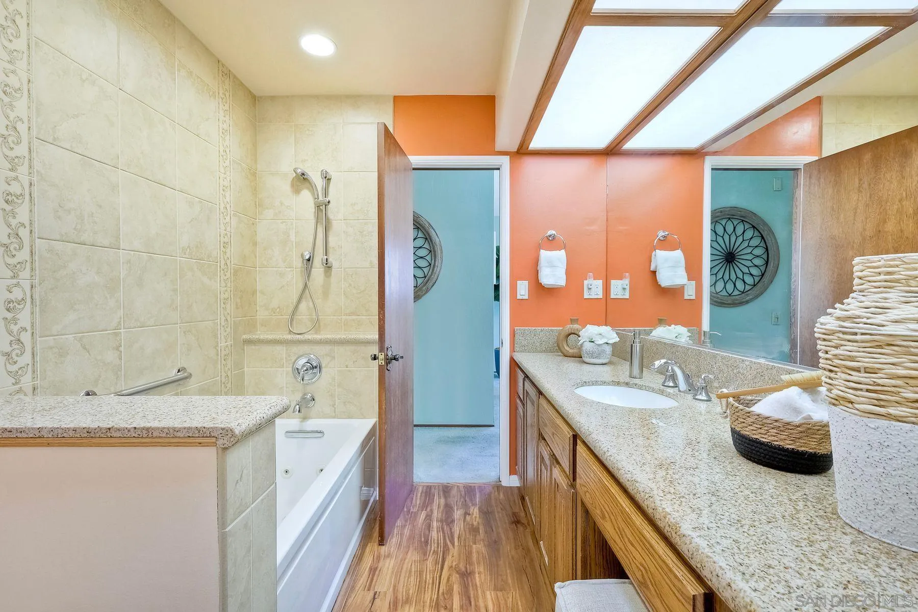 1346 Pepper Villa Drive El Cajon, CA 92021 - Photo 17 of 25 a bathroom with a granite countertop sink and a large mirror