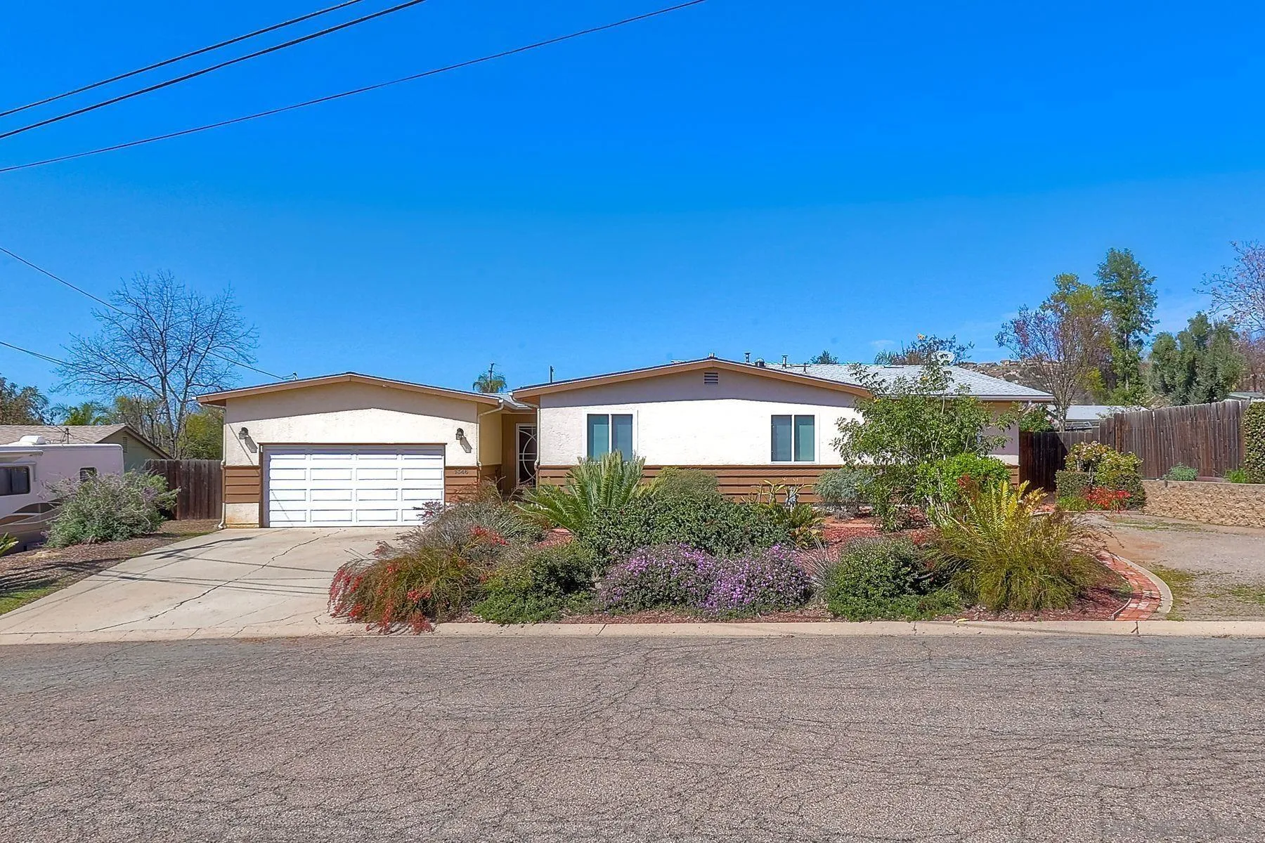 1346 Pepper Villa Drive El Cajon, CA 92021 - Photo 25 of 25 a front view of a house with a yard and garage