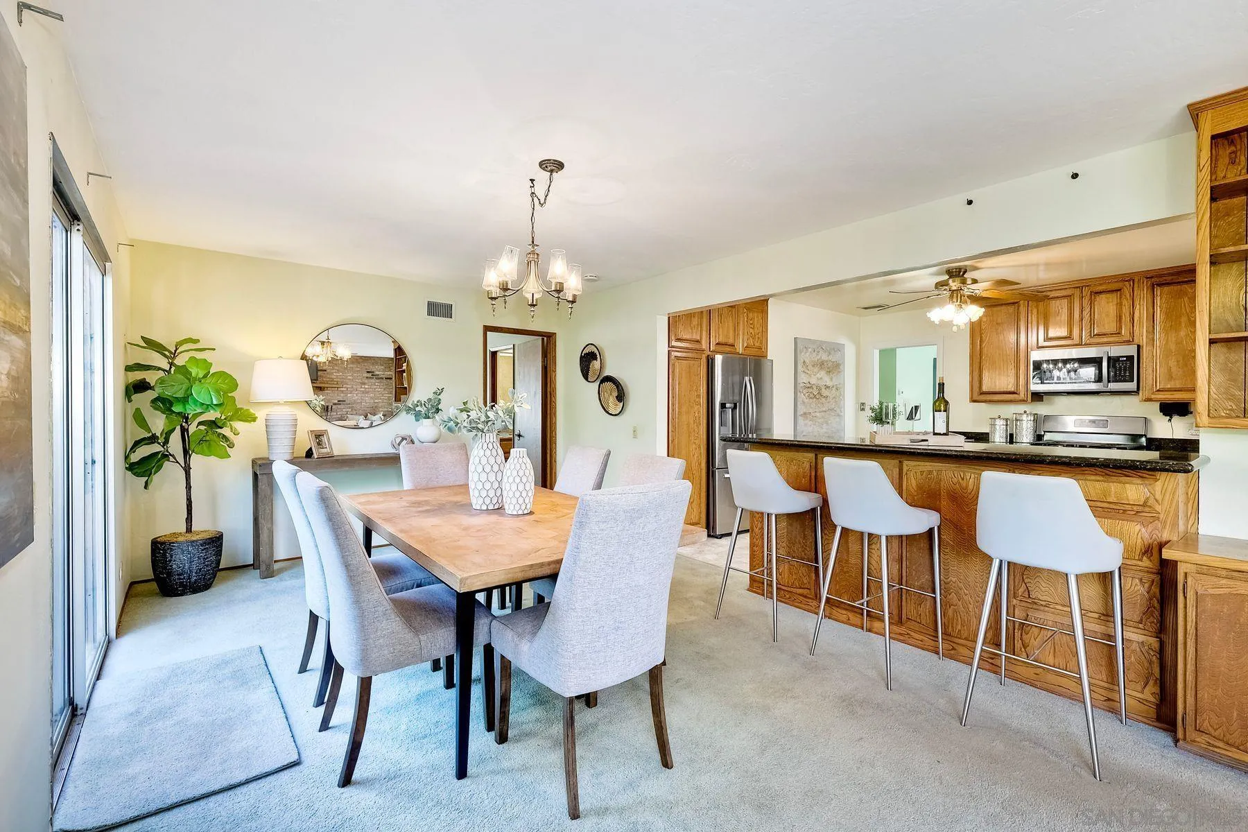 1346 Pepper Villa Drive El Cajon, CA 92021 - Photo 10 of 25 a view of a dining room with furniture and a chandelier