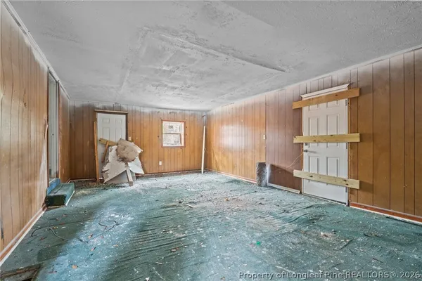 a view of empty room with front door