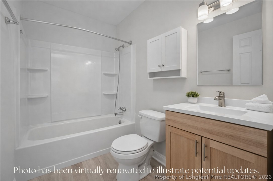 217 South Grove Avenue Rockingham, NC 28379 - Photo 20 of 37 a bathroom with a sink a toilet and a bathtub