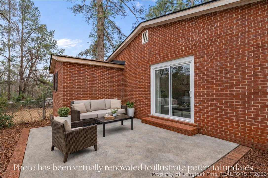 217 South Grove Avenue Rockingham, NC 28379 - Photo 27 of 37 a outdoor living space with patio furniture