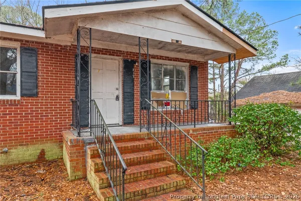 a front view of a house with a porch