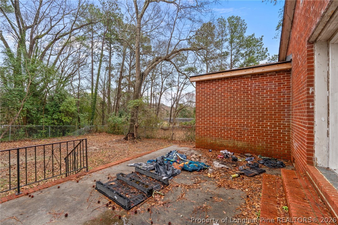 217 South Grove Avenue Rockingham, NC 28379 - Photo 32 of 37 a backyard of a house with lots of green space