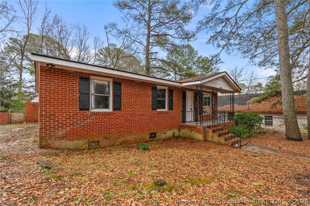 217 South Grove Avenue Rockingham, NC 28379 - Photo 33 of 37 a view of a house with a yard