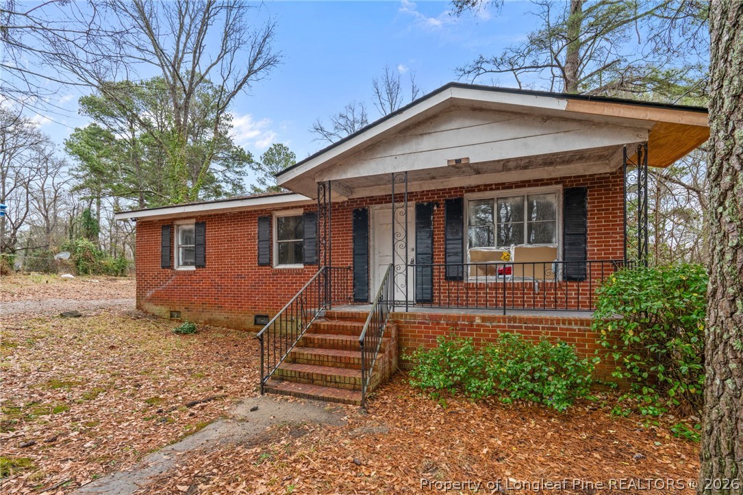 217 South Grove Avenue Rockingham, NC 28379 - Photo 34 of 37 a front view of a house with a yard