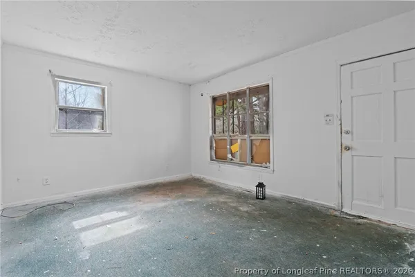 a view of empty room with front door