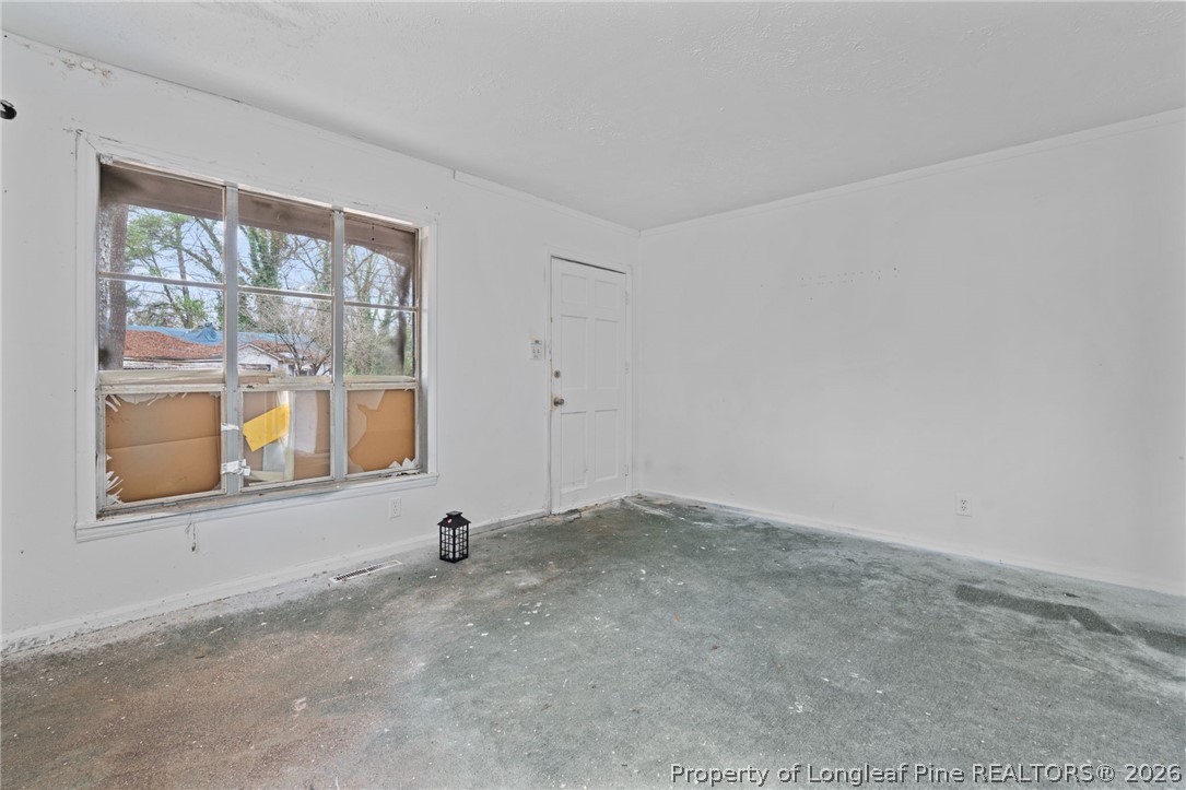 217 South Grove Avenue Rockingham, NC 28379 - Photo 7 of 37 an empty room with a window