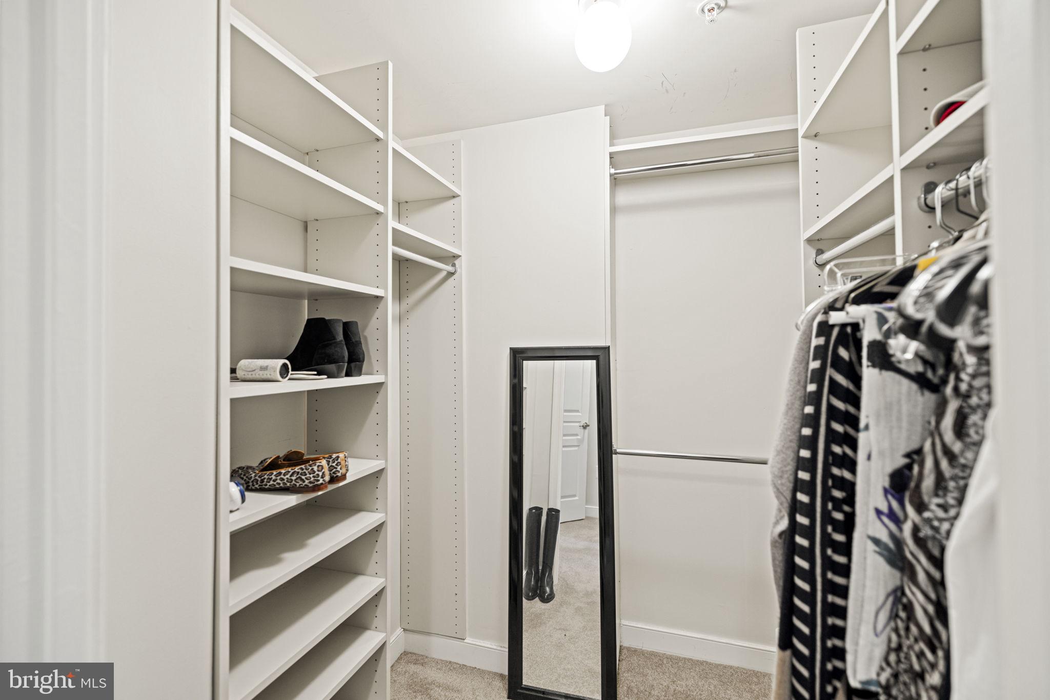 616 E Street Northwest, Unit 1152 Washington, DC 20004 - Photo 17 of 92 a view of walk in closet with clothes and shoes