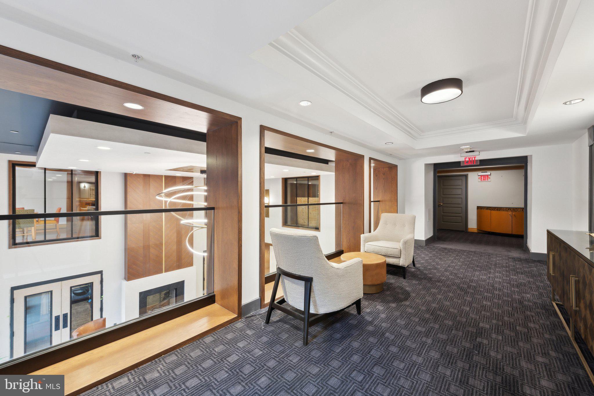 616 E Street Northwest, Unit 1152 Washington, DC 20004 - Photo 47 of 92 a living room with furniture and a fireplace